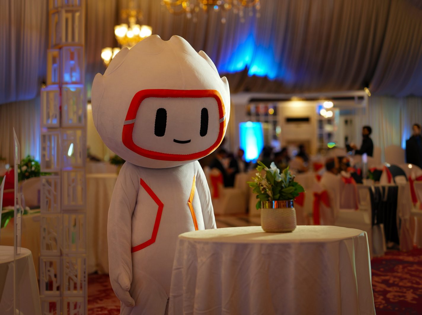 Robot brand mascot costume at a live event
